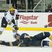 Michigan sophomore center Travis Lynch shoots over Windsor defense Clinton Mackenzie in the game on Tuesday. Michigan won 7-3. Daniel Brenner I AnnArbor.com